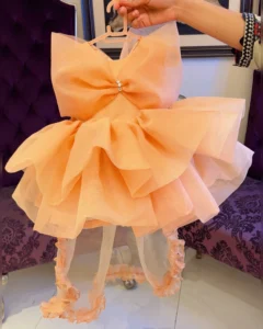 Peach Organza High-Low Dress with Oversized Bow & Ruffled Train – Baby Girl Party Frock